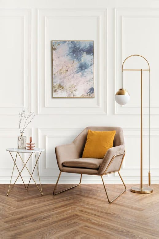 Warm modern interior with armchair and amber cushion